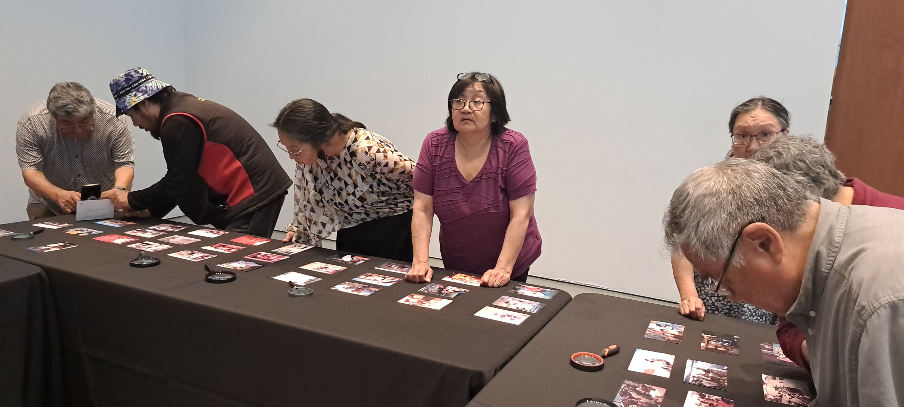 Elders looking at photos.