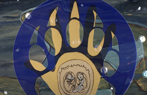  A blue circle with a bear's claw in it.