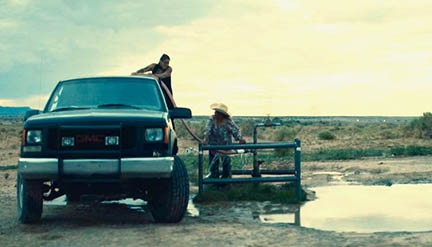 Layla Staats (on truck) from a scene in Boil Alert where she is trying to locate clean water.