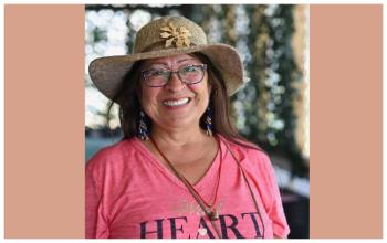 National monument steering committee member Dorene Bernard wears a pink shirt with the word heart written on it.