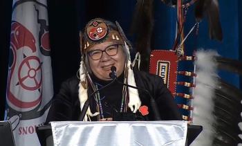 National Chief RoseAnne Archibald at podium smiling