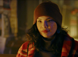 A young woman wearing a red toque and winter jacket is seen in the film Redlights.