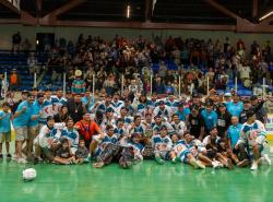 A winning team photo taken on the field of the Mann Cup lacrosse final.